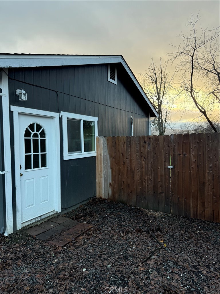 9707 Main Upper Lake, CA 95485 - Photo 1 of 1 a house with wooden fence