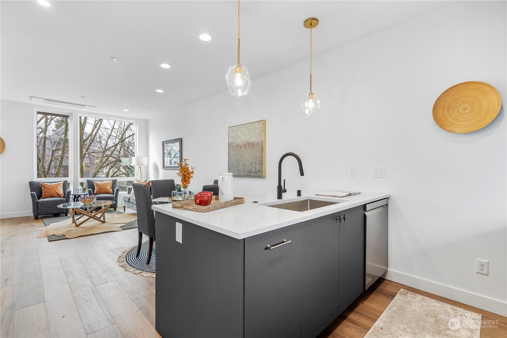 6014 B California Avenue Southwest Seattle, WA 98136 - Photo 14 of 27 a room with a sink dishwasher and a stove with wooden floor