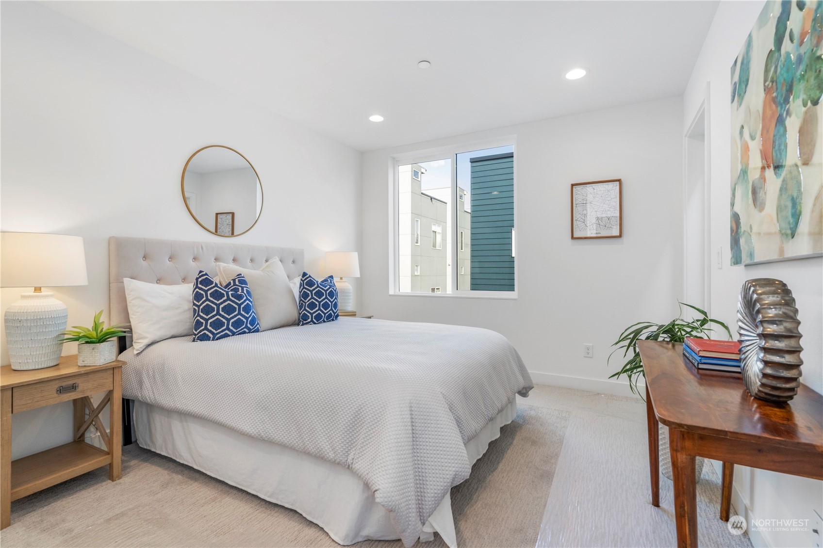 6014 B California Avenue Southwest Seattle, WA 98136 - Photo 18 of 27 a bedroom with bed and a window