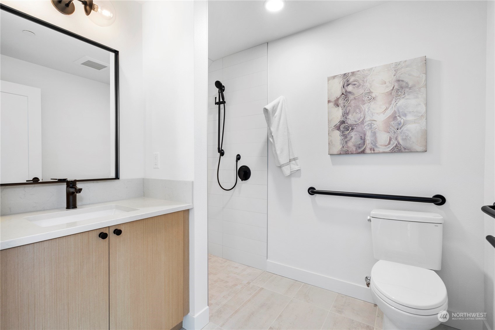 6014 B California Avenue Southwest Seattle, WA 98136 - Photo 6 of 27 a bathroom with a granite countertop sink a toilet and a mirror