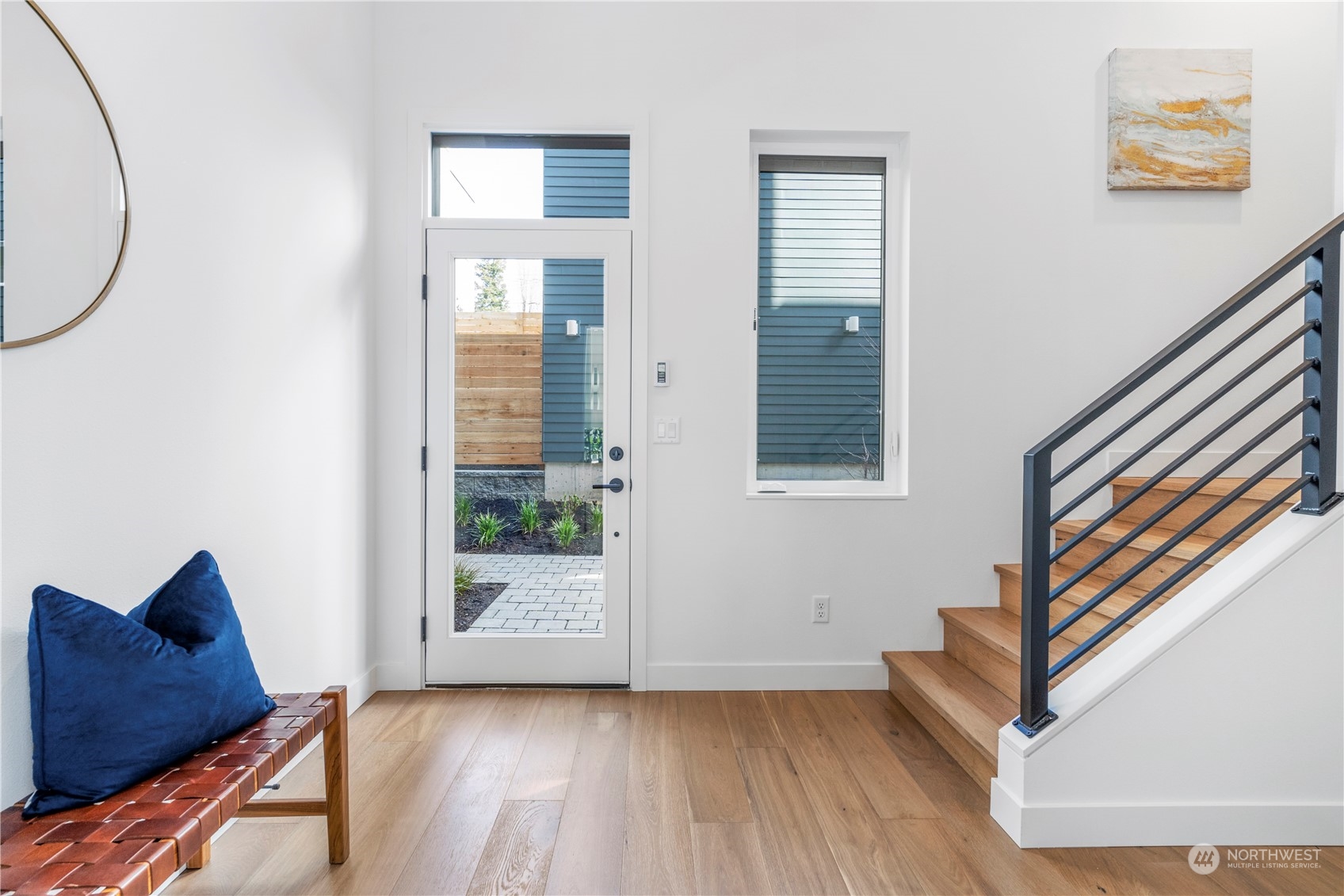 6014 B California Avenue Southwest Seattle, WA 98136 - Photo 8 of 27 a view of an empty room with wooden floor and a window