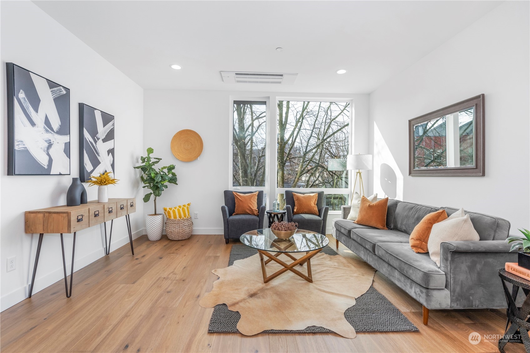 6014 B California Avenue Southwest Seattle, WA 98136 - Photo 10 of 27 a living room with furniture and wooden floor