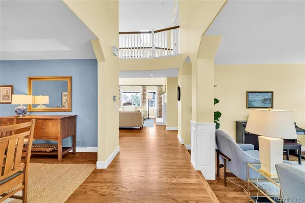 a living room with furniture and a piano