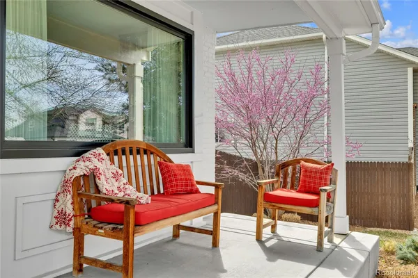 a outdoor view with a couch and wooden floor