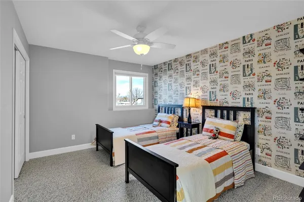 a bedroom with a bed and a potted plant