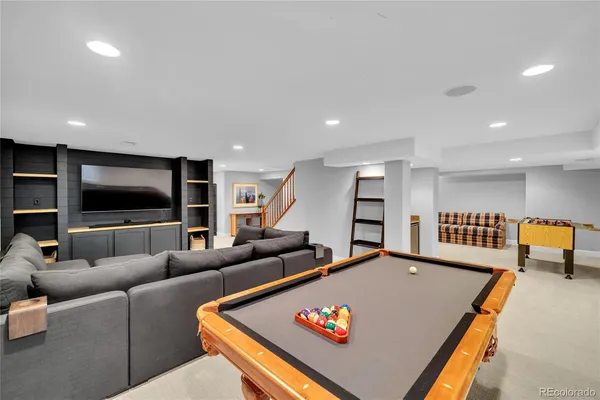 a view of a room with furniture and window
