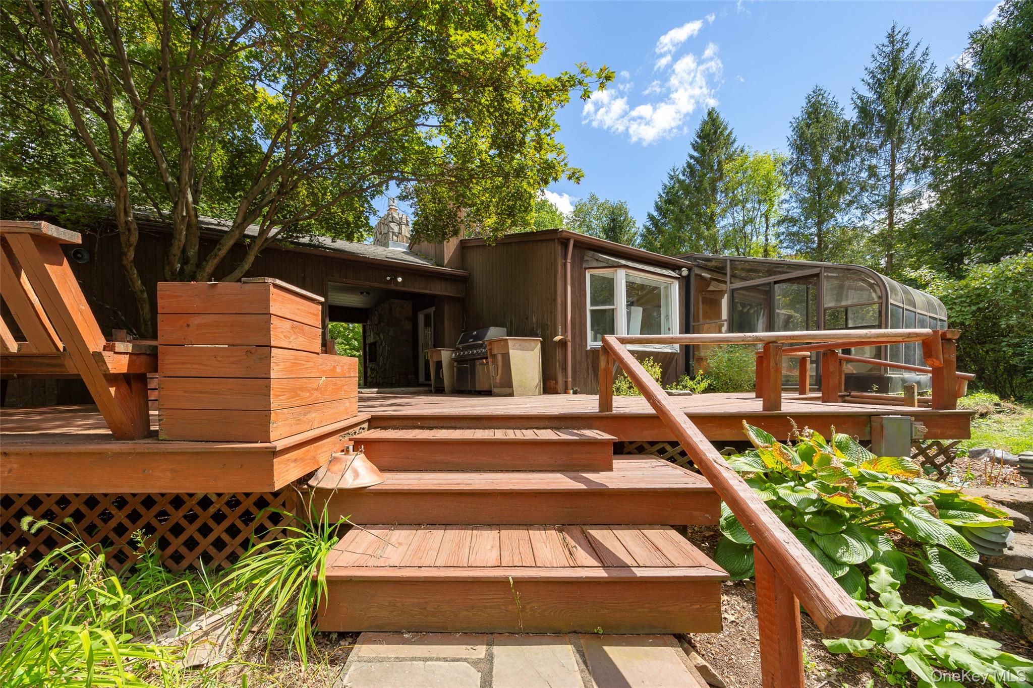 993 Highway 32 Wallkill, NY 12589 - Photo 12 of 35 Wooden deck featuring a sunroom