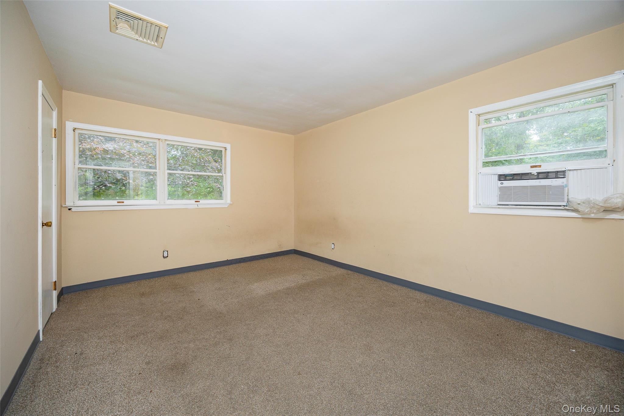 993 Highway 32 Wallkill, NY 12589 - Photo 28 of 35 Unfurnished room featuring carpet floors and healthy amount of natural light