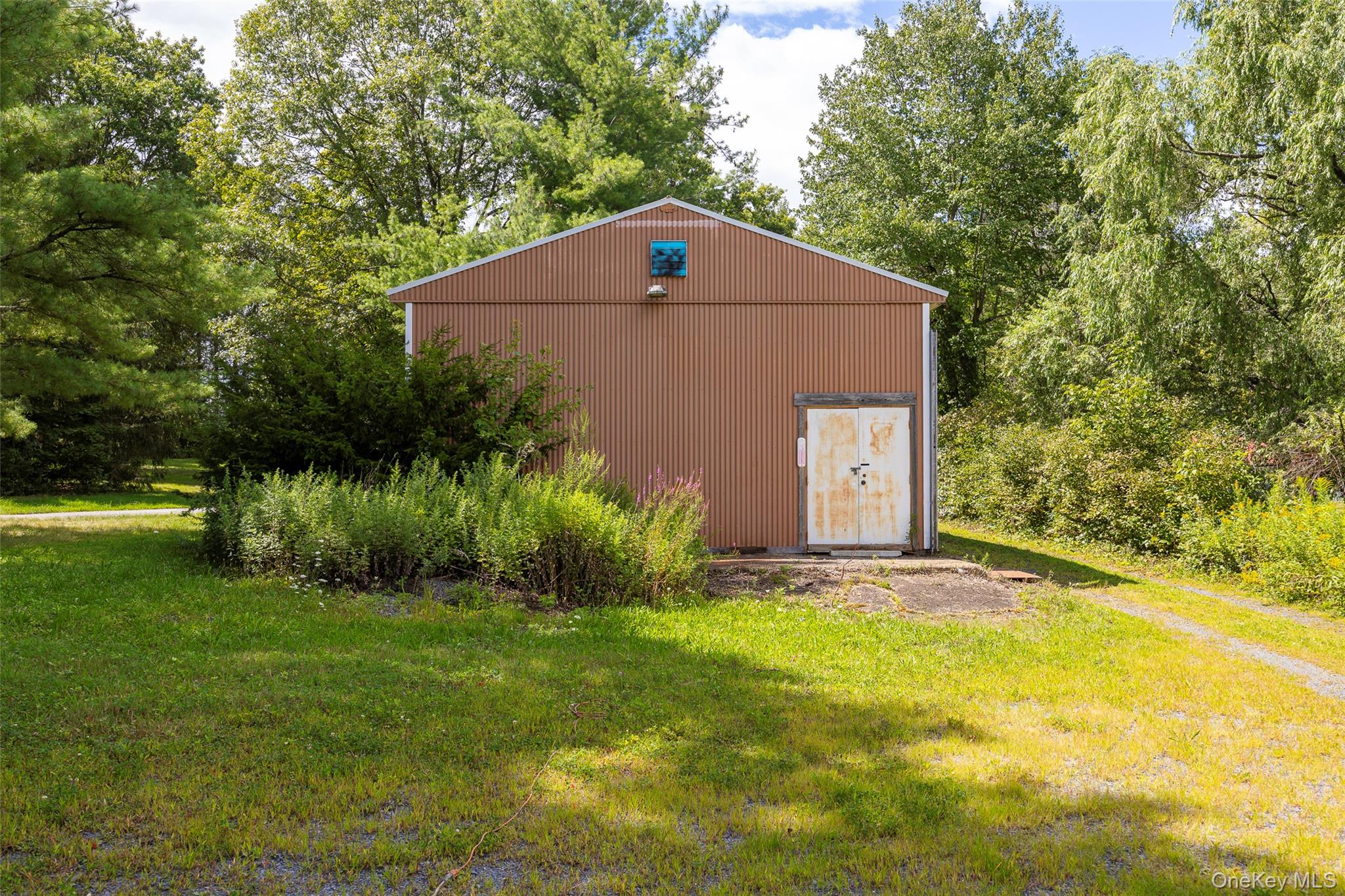 993 Highway 32 Wallkill, NY 12589 - Photo 9 of 35 View of outbuilding with view of wooded area