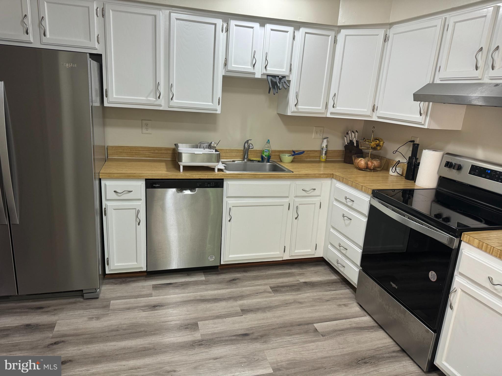 10946 Rampart Way Silver Spring, MD 20902 - Photo 3 of 11 a kitchen with stainless steel appliances granite countertop a stove a sink and a refrigerator