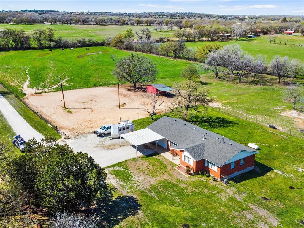 an aerial view of a house with garden