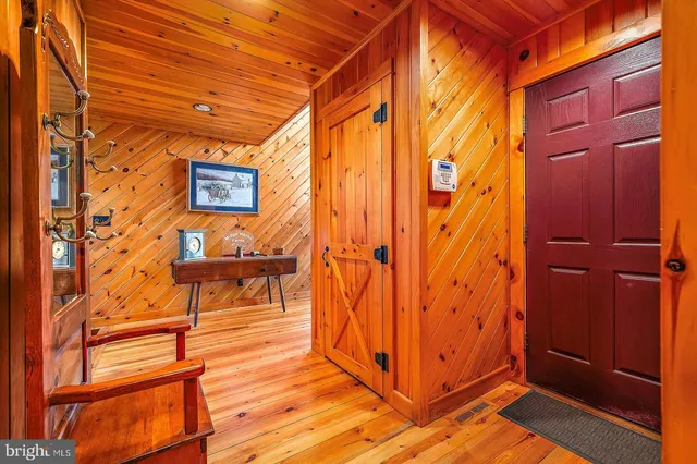 a view of outdoor space wooden shelves and entryway