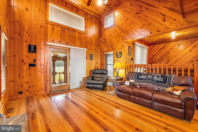 a outdoor space with lots of furniture and wooden floor