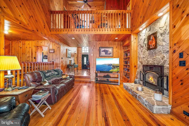 a kitchen with stainless steel appliances granite countertop a refrigerator a sink and a stove