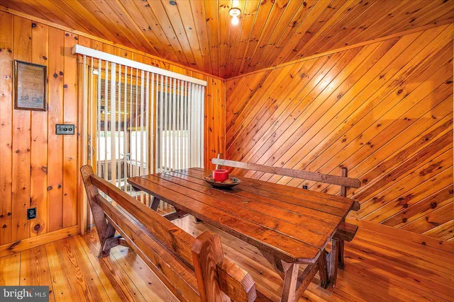 a view of a kitchen with stainless steel appliances granite countertop a refrigerator and a stove