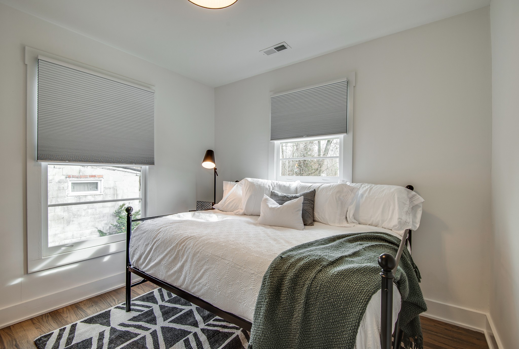 965 Green Street Franklin, TN 37064 - Photo 11 of 15 a bed sitting in a bedroom next to a window