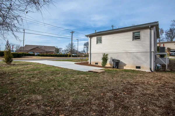 a view of a house with a backyard and window