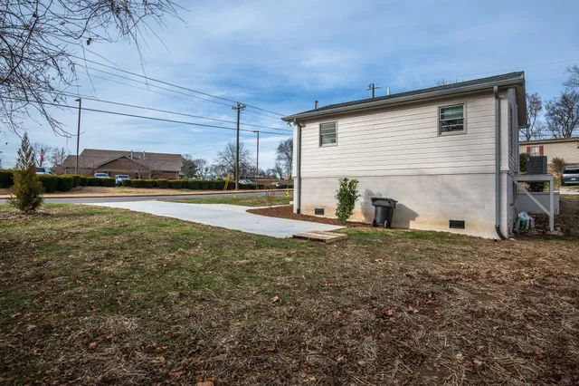 a view of a house with a backyard and window