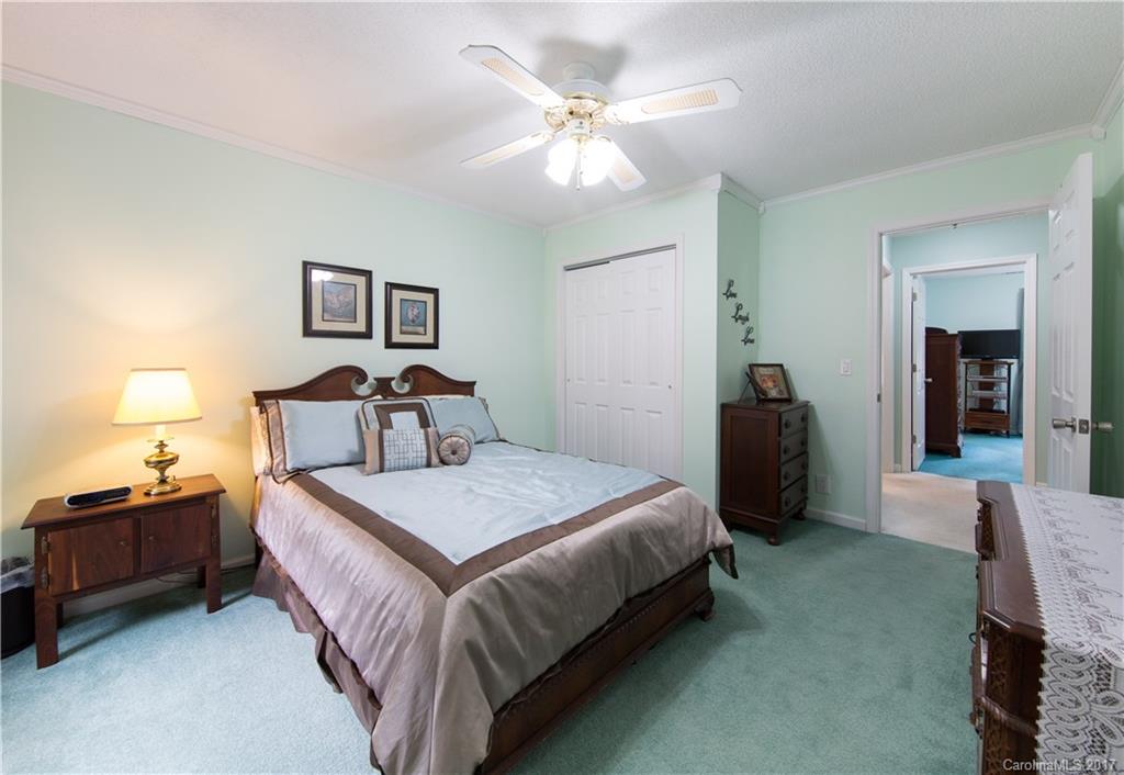 1610 Deer Run Road Catawba, SC 29704 - Photo 11 of 23 a bedroom with bed and a chandelier