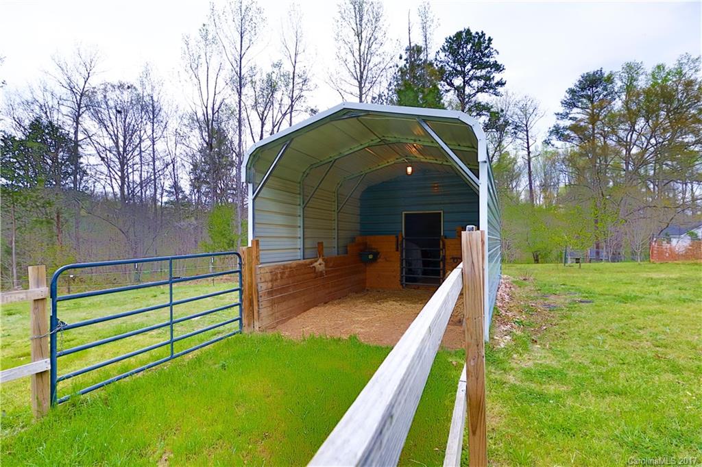 1610 Deer Run Road Catawba, SC 29704 - Photo 20 of 23 a view of a garden with a wooden fence