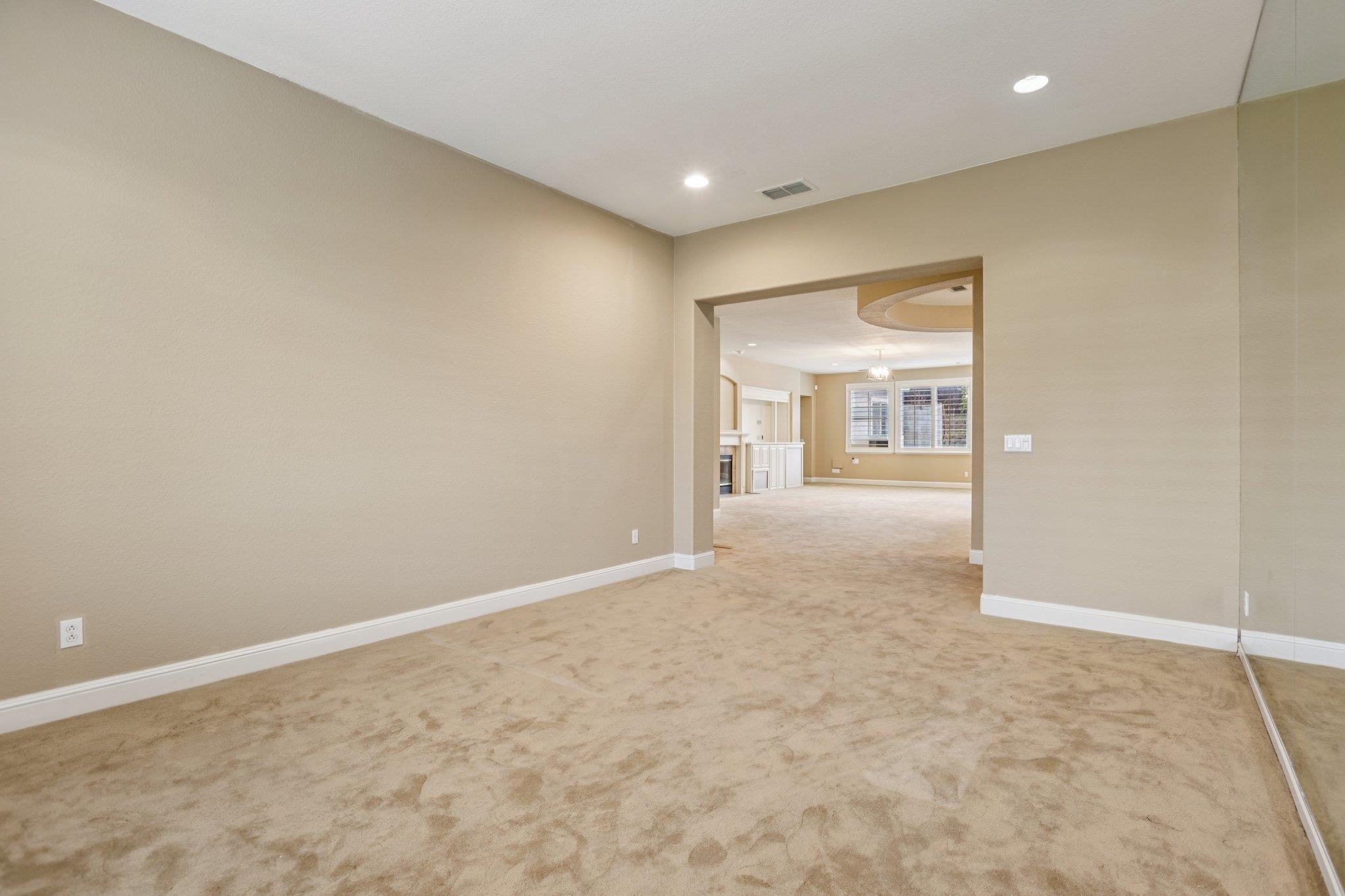 5227 Ramsdell Court Antioch, CA 94531 - Photo 17 of 58 Empty room with light colored carpet and recessed lighting