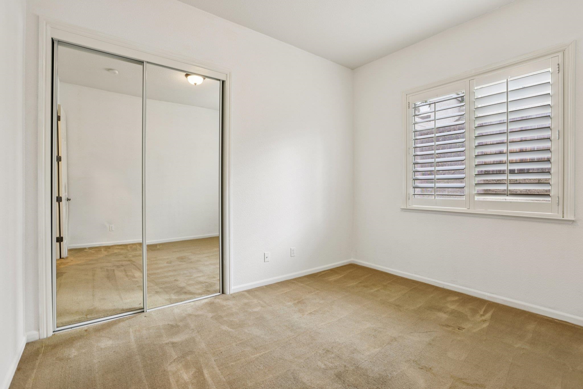 5227 Ramsdell Court Antioch, CA 94531 - Photo 27 of 58 Unfurnished bedroom with light colored carpet and a closet