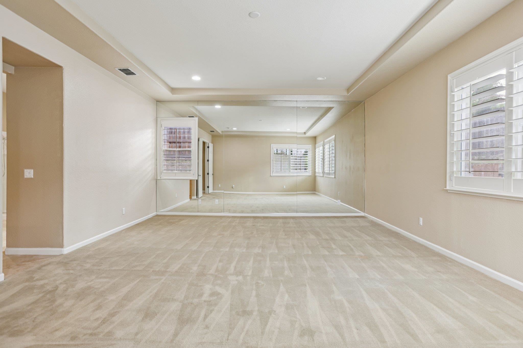 5227 Ramsdell Court Antioch, CA 94531 - Photo 37 of 58 Unfurnished room featuring a raised ceiling, light colored carpet, and recessed lighting