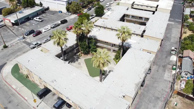 an aerial view of residential houses with outdoor space