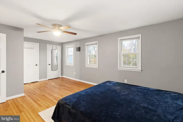 a bedroom with a large bed and a window