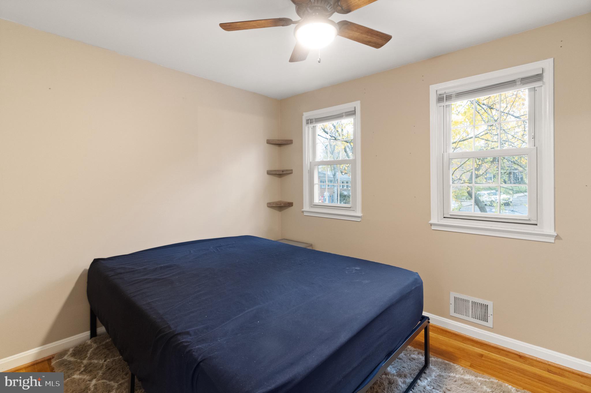 1315 Mead Terrace Woodbridge, VA 22191 - Photo 15 of 32 a bedroom with a bed and a window