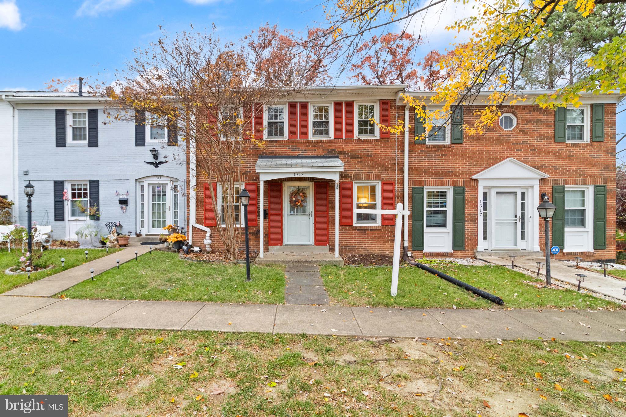 1315 Mead Terrace Woodbridge, VA 22191 - Photo 31 of 32 front view of a brick house with a yard