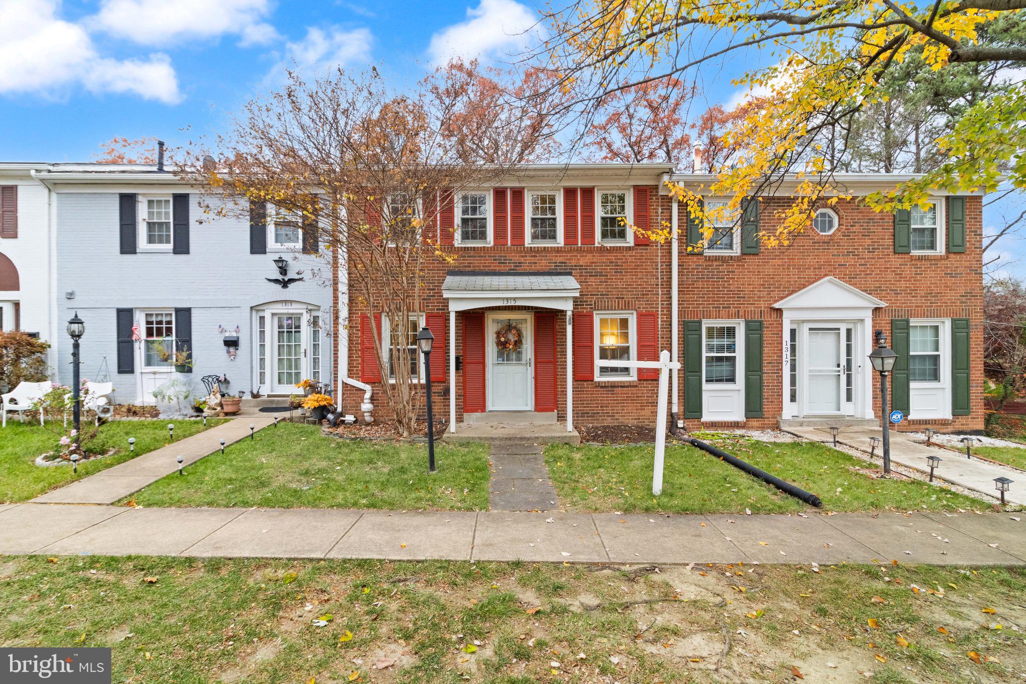 1315 Mead Terrace Woodbridge, VA 22191 - Photo 32 of 32 front view of a brick house with a yard