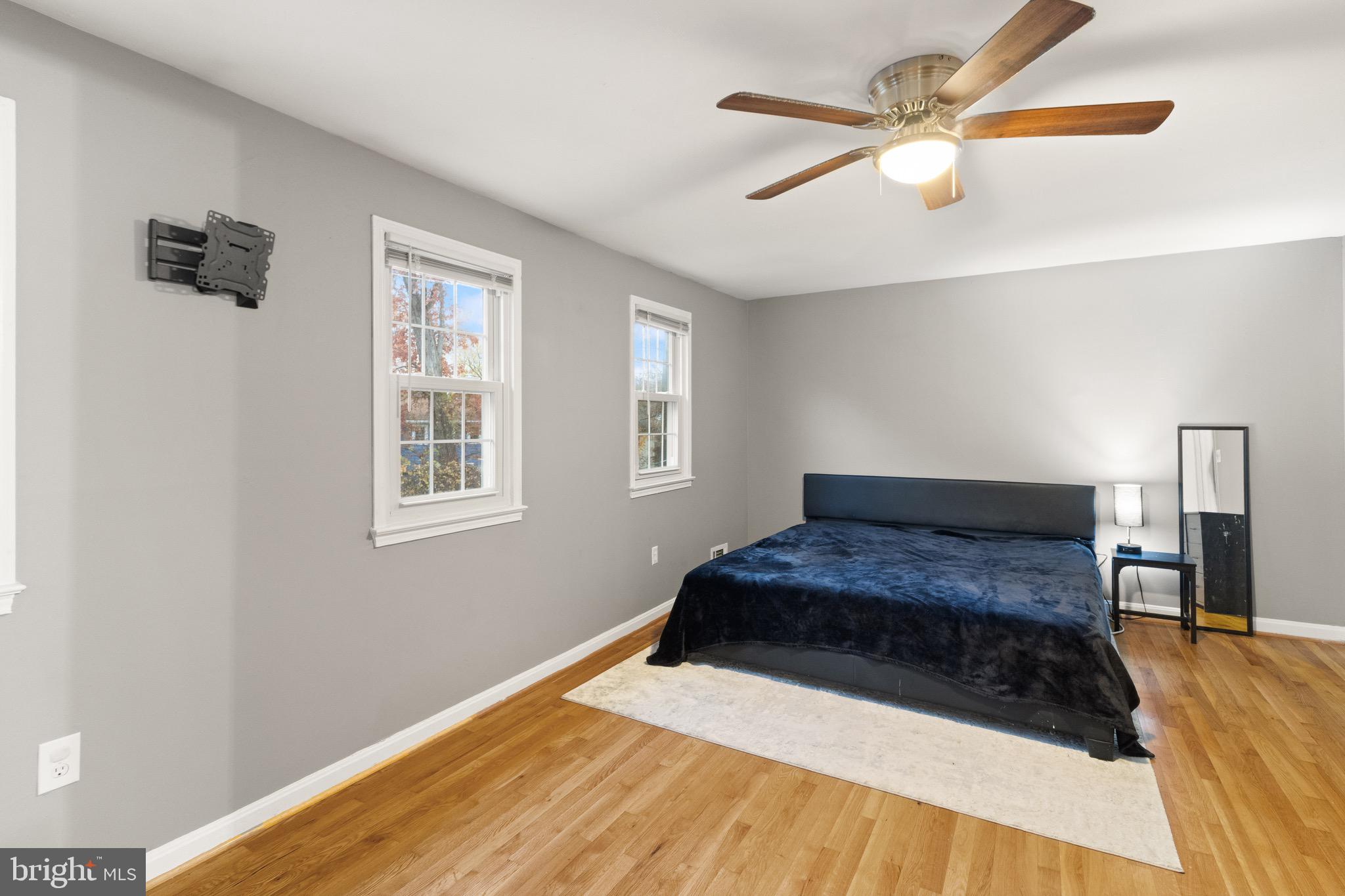 1315 Mead Terrace Woodbridge, VA 22191 - Photo 9 of 32 a bedroom with a bed and a chandelier