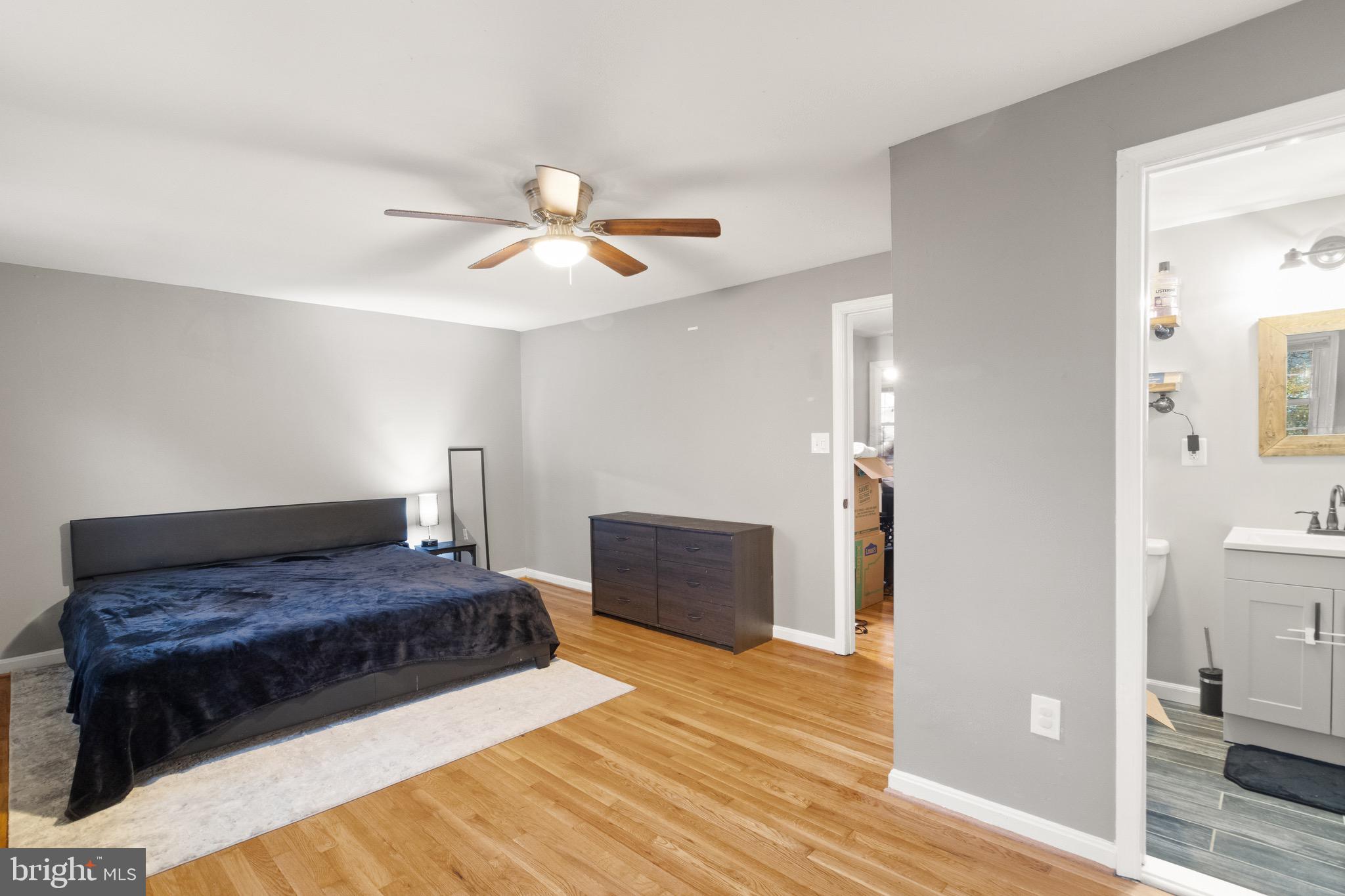1315 Mead Terrace Woodbridge, VA 22191 - Photo 10 of 32 a bedroom with a bed and a chandelier