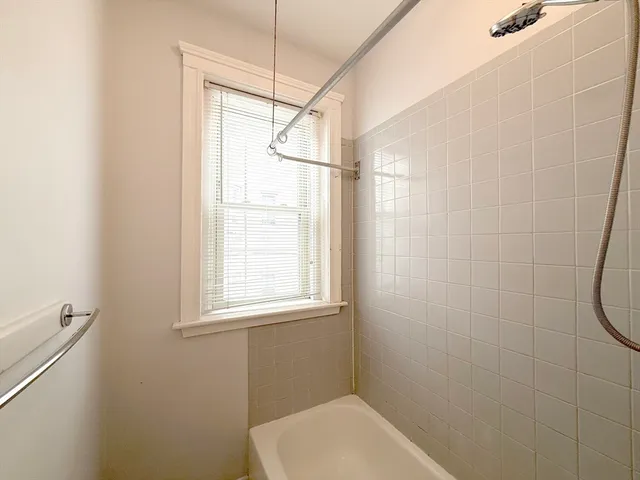 a bathroom with a toilet and shower