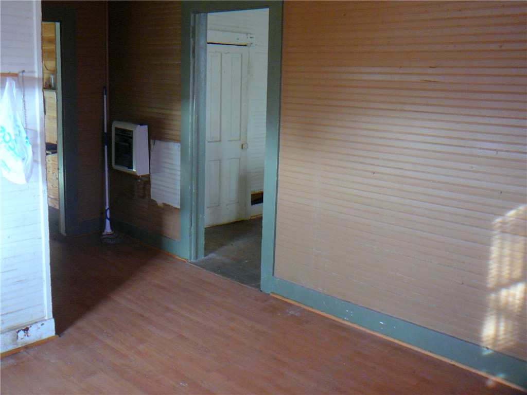 2 Sirrine Street Honea Path, SC 29654 - Photo 9 of 10 This interior space showcases charming natural wood walls and durable hardwood flooring.