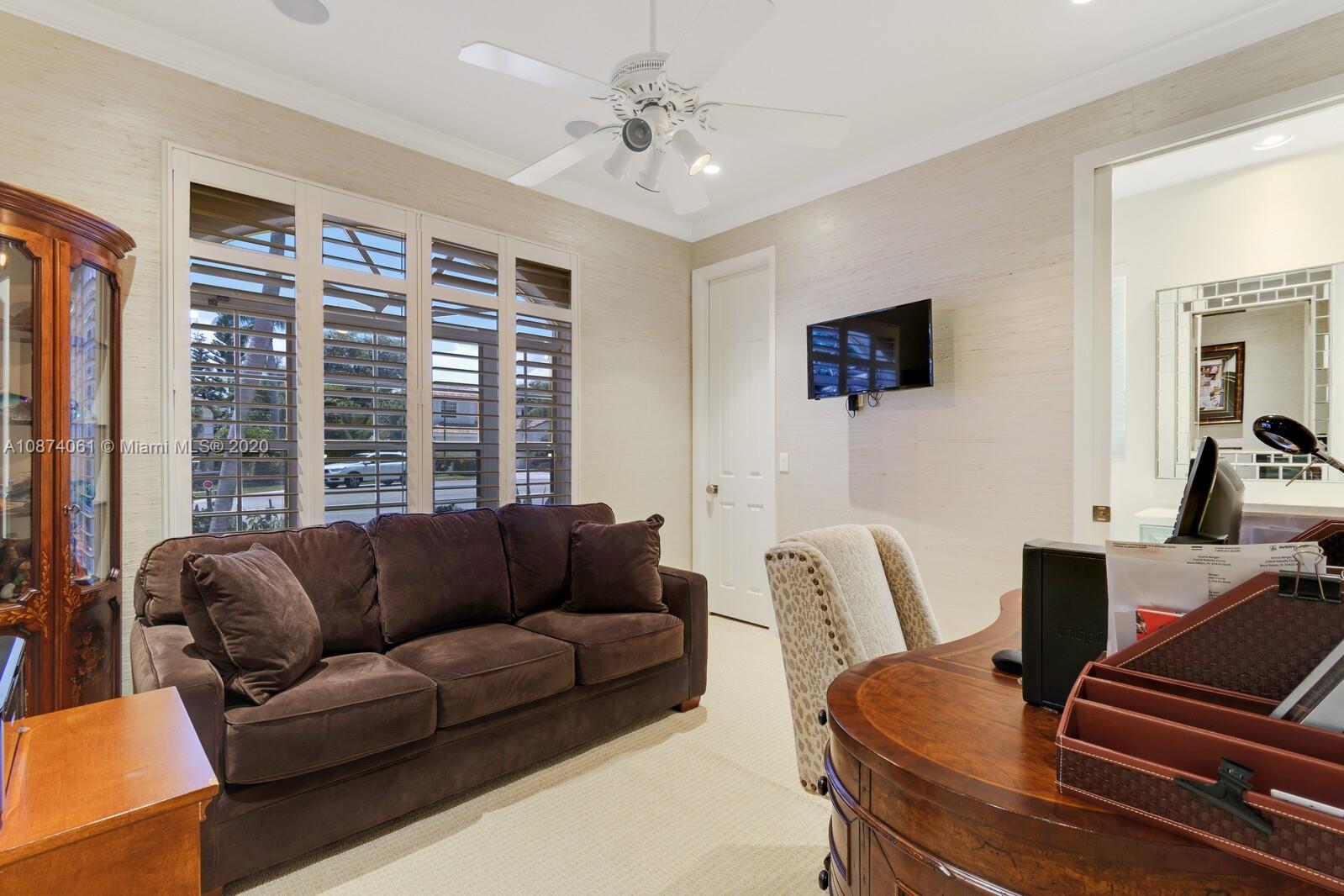 23434 Rakelle Circle Boca Raton, FL 33433 - Photo 17 of 40 a living room with furniture and a flat screen tv