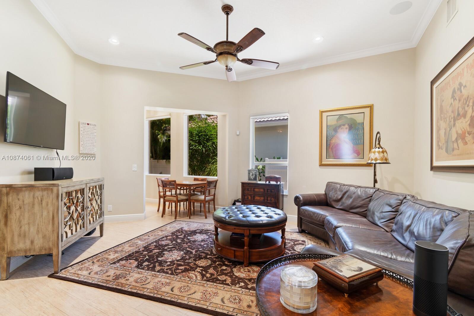 23434 Rakelle Circle Boca Raton, FL 33433 - Photo 8 of 40 a living room with furniture and a flat screen tv