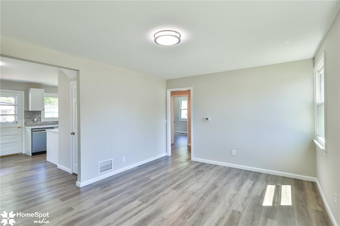 415 Willow Road Hellertown, PA 18055 - Photo 24 of 25 An open floor plan with stylish flooring flows seamlessly into the kitchen area.