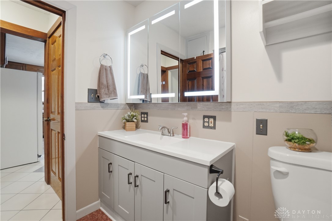 7553 Coffin Station Road Springfield, OH 45502 - Photo 58 of 95 This bathroom features a contemporary vanity with a sleek sink, offering both style and functionality.