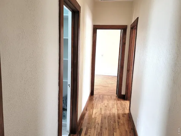a view of a bathroom from a hallway