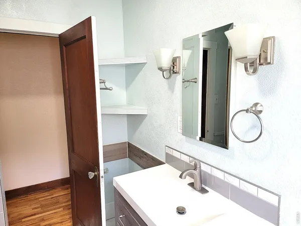 a bathroom with a sink and a mirror