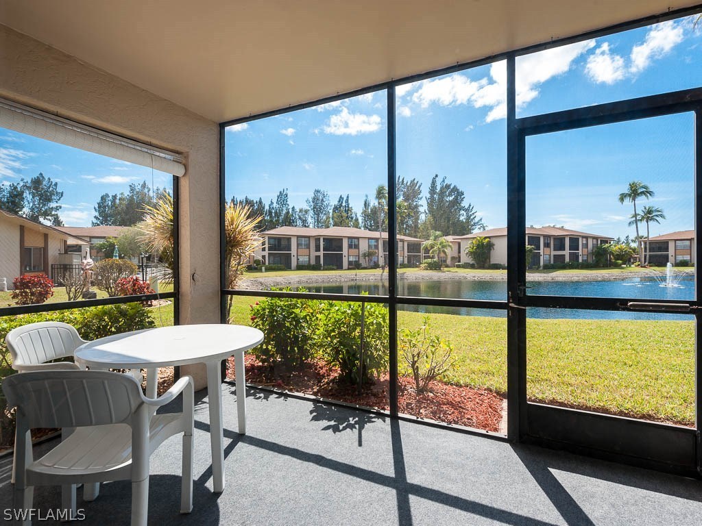 a view of a room with a table and chairs