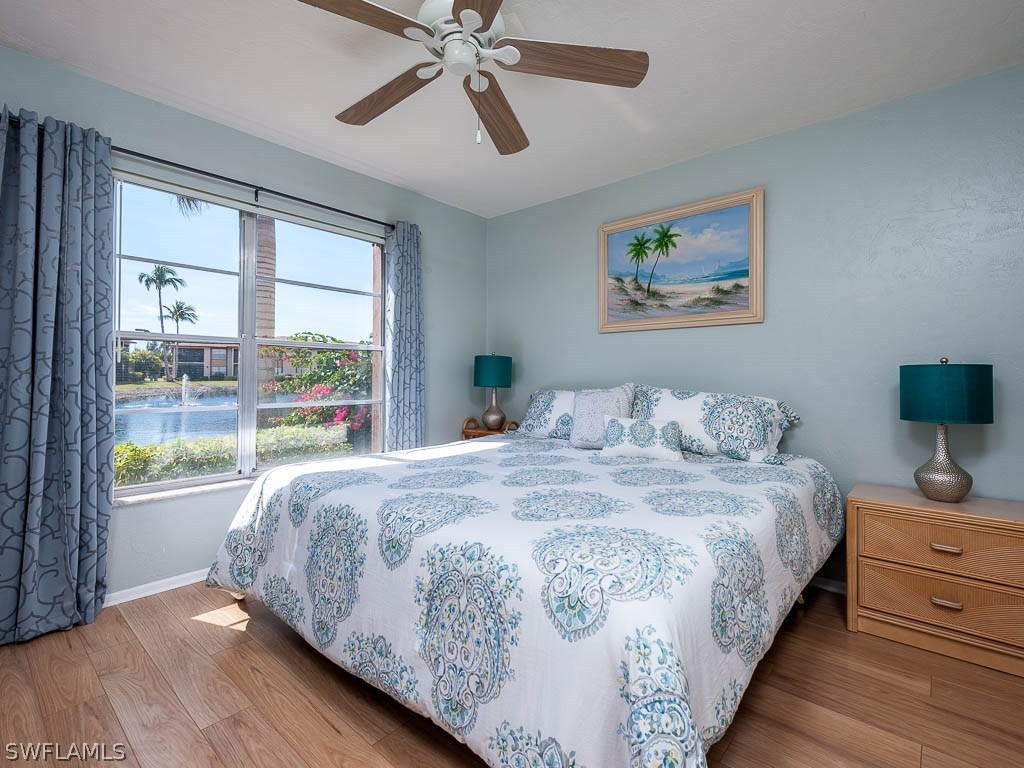 16881 Davis Road, Unit 414 Fort Myers, FL 33908 - Photo 11 of 24 a bedroom with bed and window
