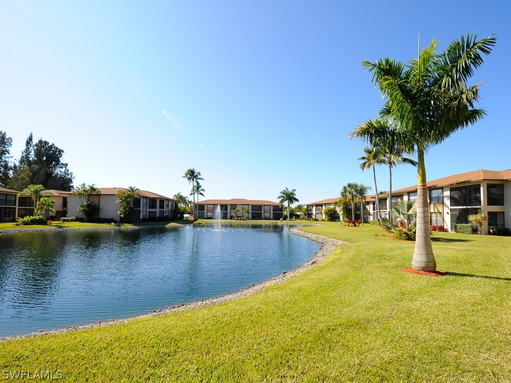 16881 Davis Road, Unit 414 Fort Myers, FL 33908 - Photo 15 of 24 a view of a swimming pool with lounge chair