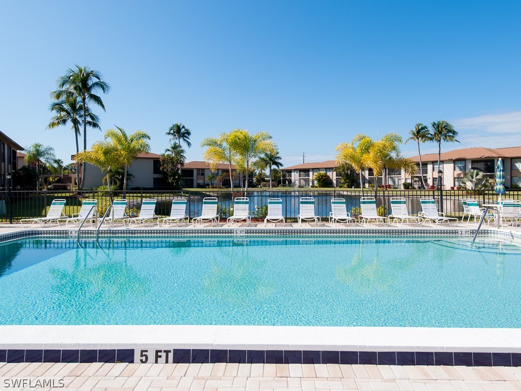 16881 Davis Road, Unit 414 Fort Myers, FL 33908 - Photo 19 of 24 a view of swimming pool with outdoor seating