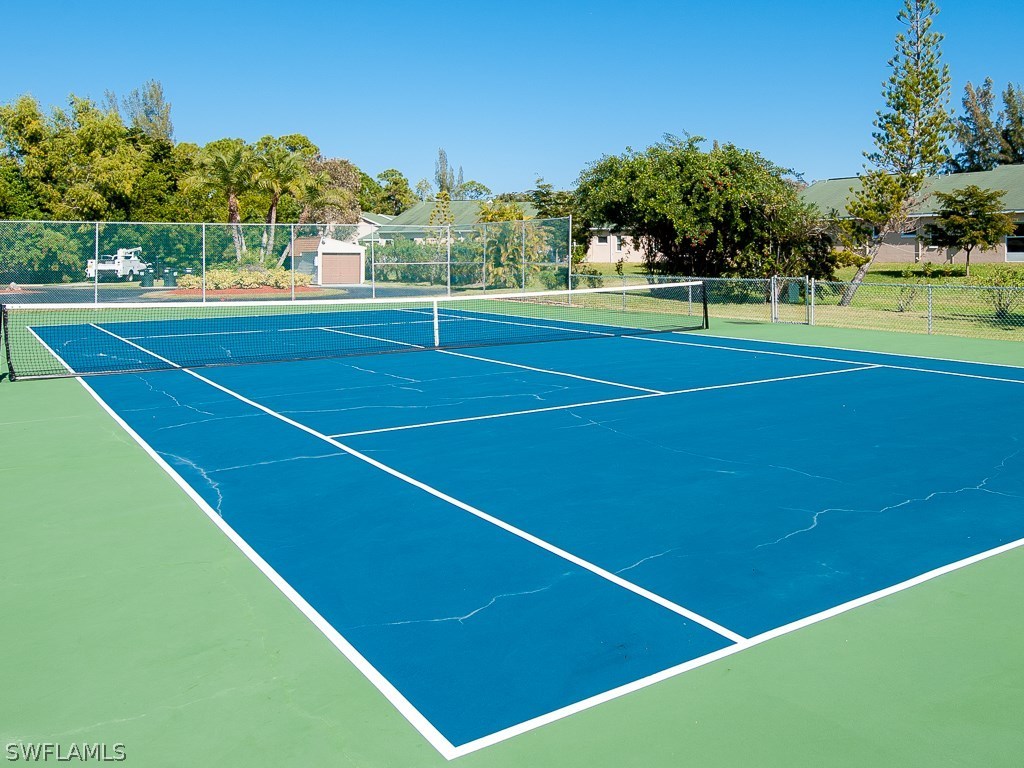 16881 Davis Road, Unit 414 Fort Myers, FL 33908 - Photo 21 of 24 a view of an outdoor space and tennis court