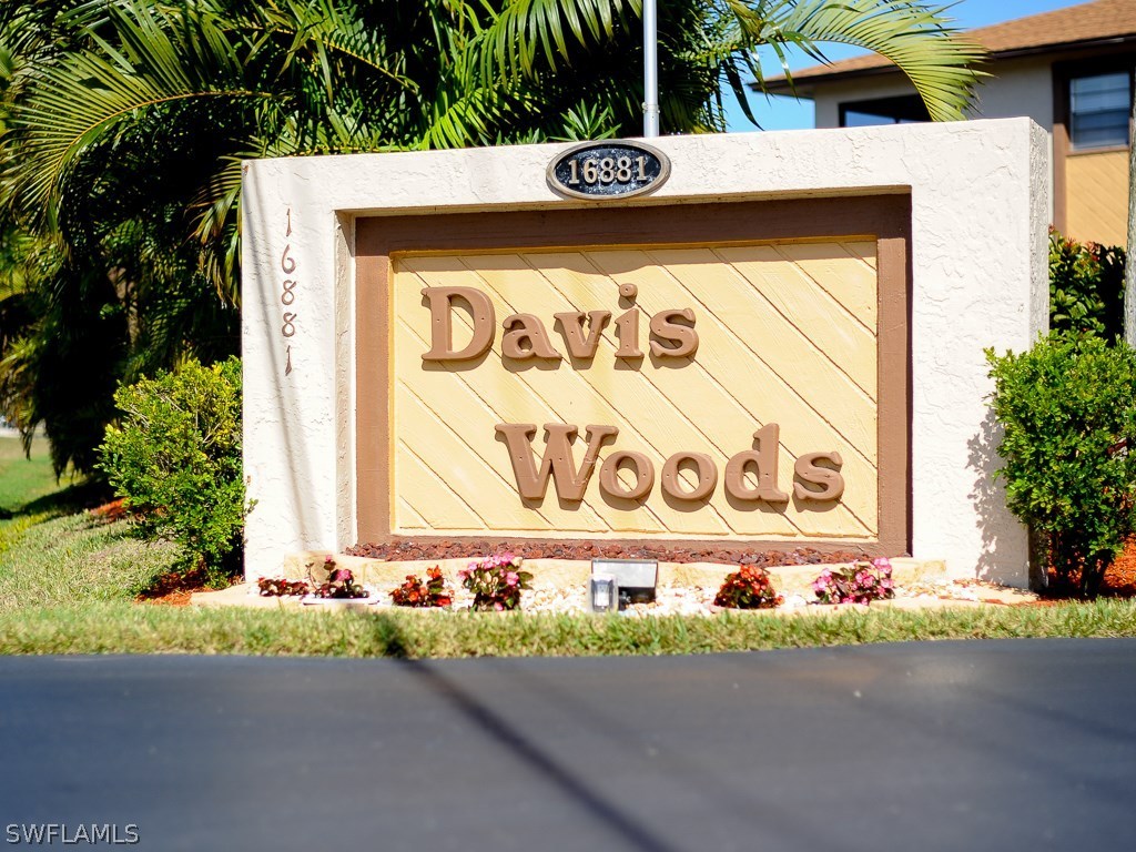 16881 Davis Road, Unit 414 Fort Myers, FL 33908 - Photo 24 of 24 a street sign on the side of building