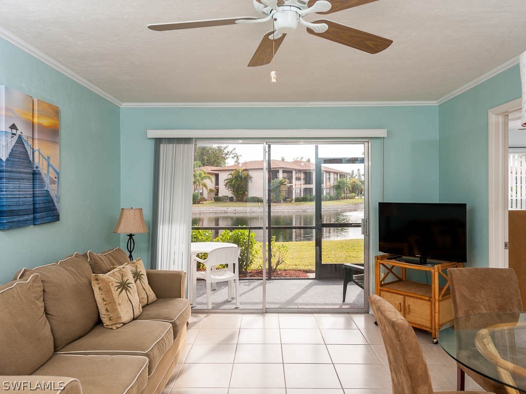 16881 Davis Road, Unit 414 Fort Myers, FL 33908 - Photo 5 of 24 a living room with furniture and a flat screen tv