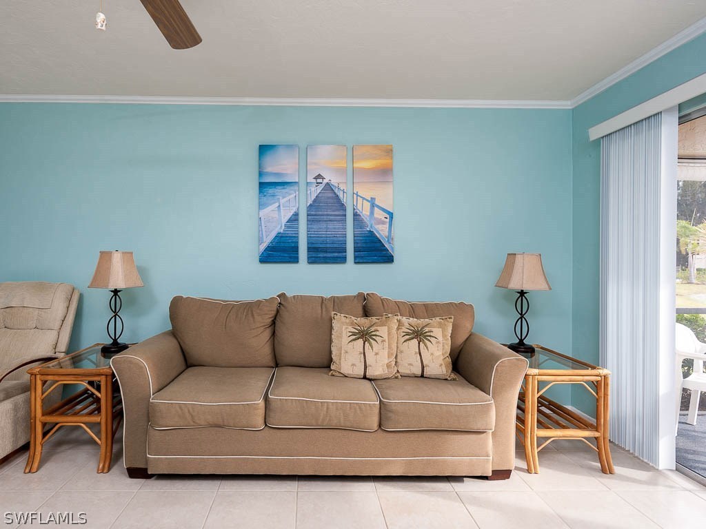 16881 Davis Road, Unit 414 Fort Myers, FL 33908 - Photo 7 of 24 a living room with furniture and a window